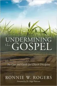 A book cover with grass and the words " undermining the gospel."